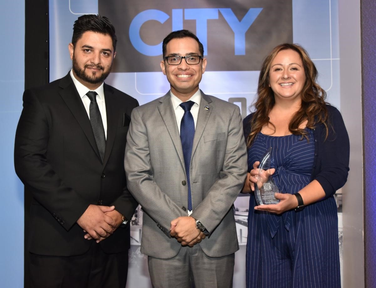 Mayor Gutierrez and Fadi and Carina Ballout, owners of the Cupcake and Espresso Bar.