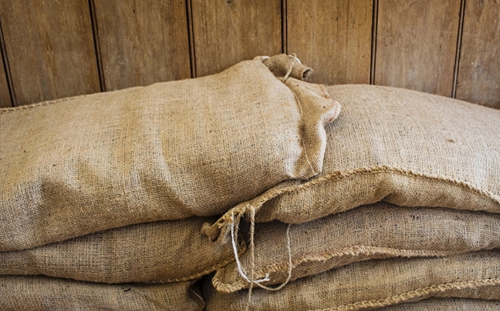 Photo of stacked sandbags.