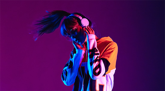 Teen with headphones on dancing